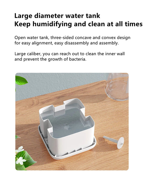 The Drift with its 500ml water tank open on a wooden table